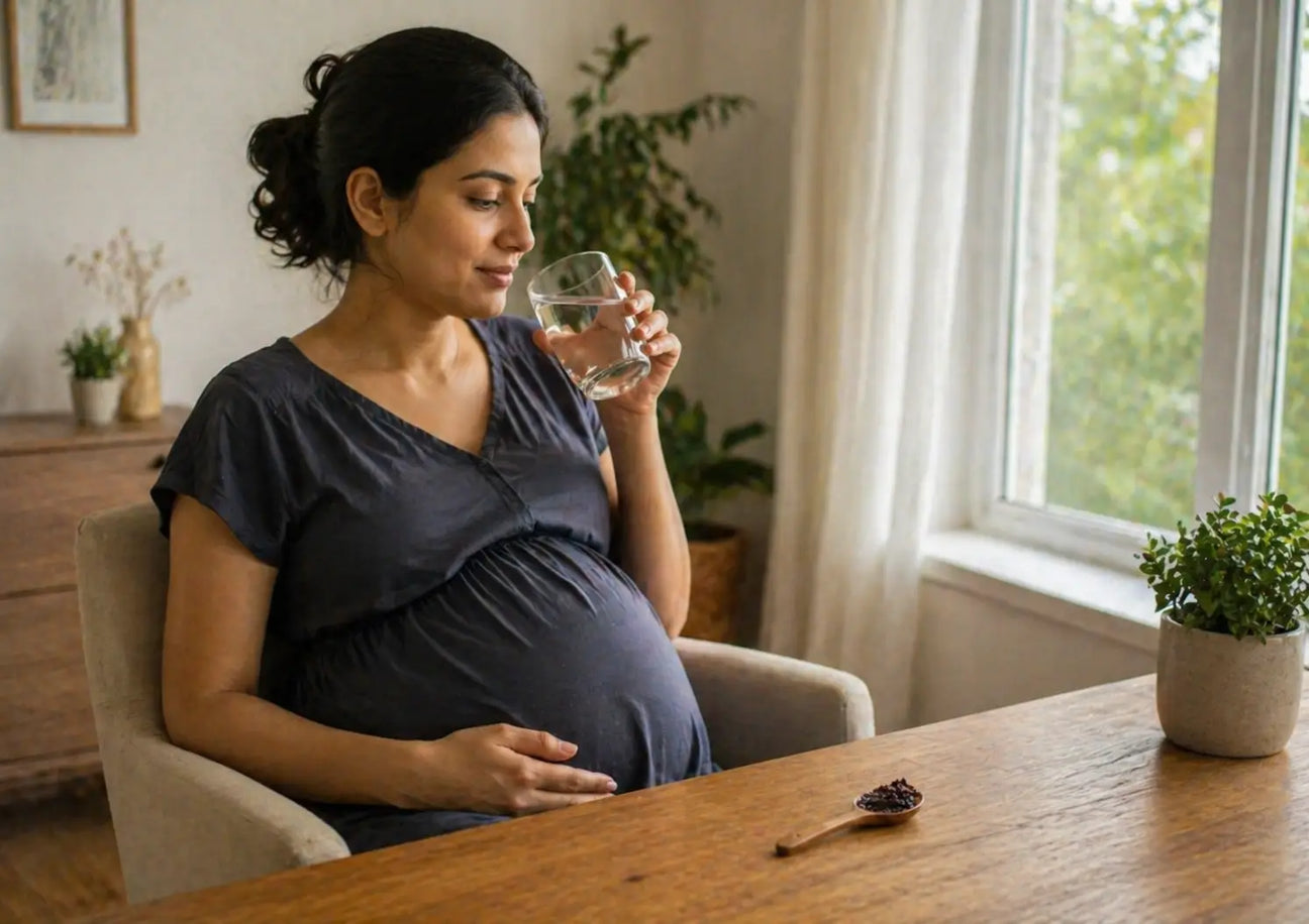 Pregnant woman reviewing supplement use including shilajit during pregnancy at home