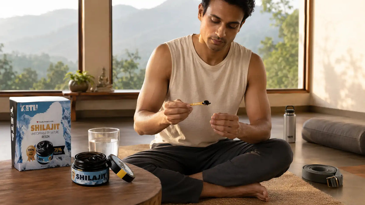 Indian yoga practitioner with shilajit and warm water before a peaceful morning yoga practice